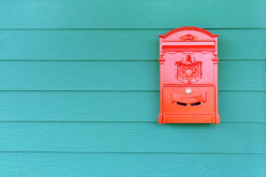 Red mailbox with green wood, vintage style