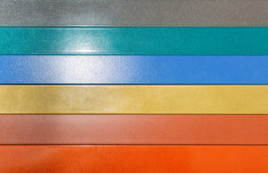 Rows of powder coated paneling in a spectrum of colors. 